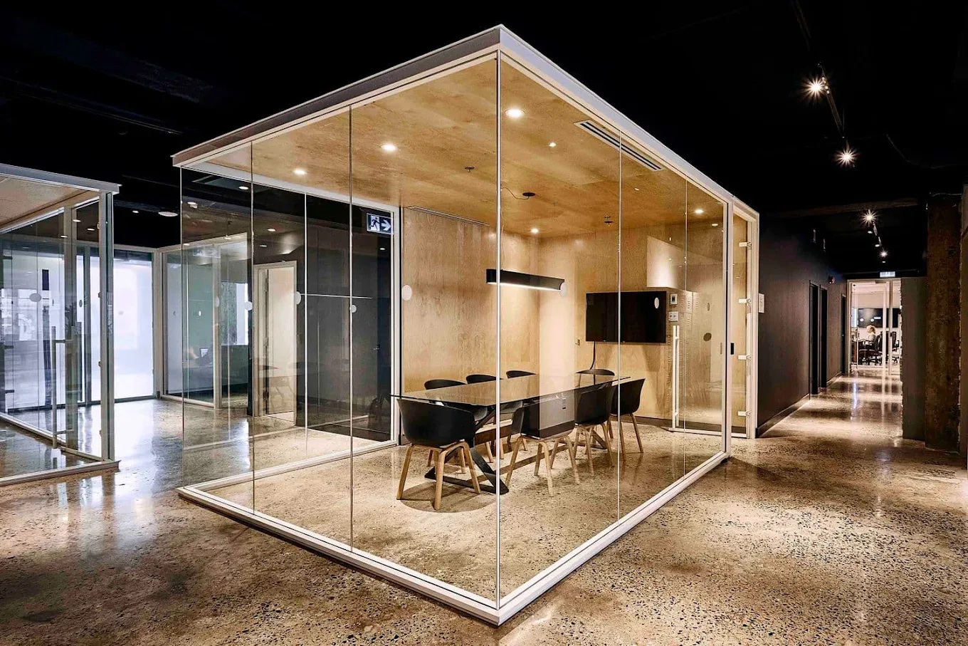 Glass-walled boardroom in the Aloweb workspace